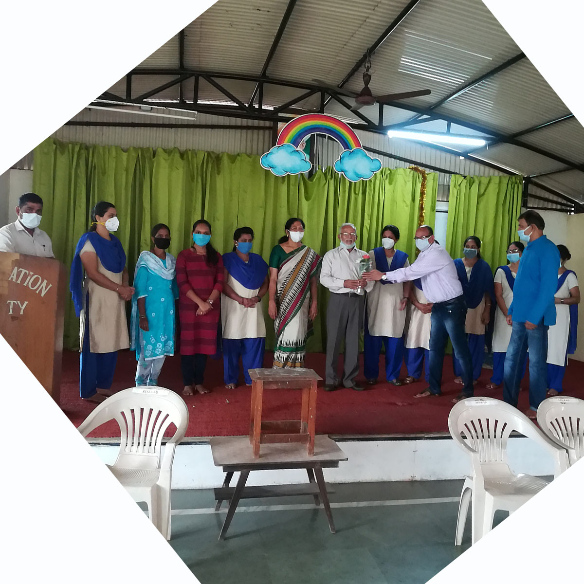 Vidyanagar Association President Shri Santosh Desai felicitating the principal Mr. Cherian Kurvilla on his School securing 100% results in SSC exams.