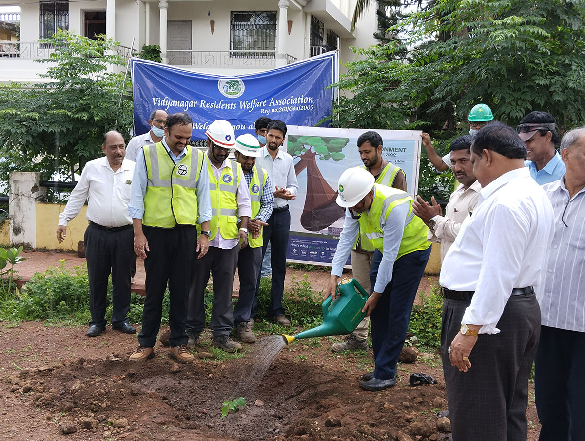 Seen here is Shri Gurumurthy Venkat Murty watering the sapling. Also in the photo is Project Manager,  L&T Ltd., Adora De Goa Project (partially visible) along with other members of L&T and members of the Vidyanagar Association.