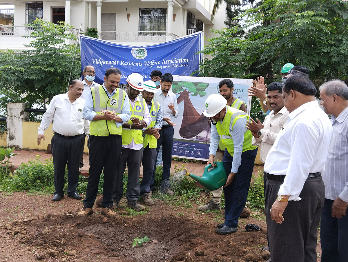 Seen here is Shri Gurumurthy Venkat Murty watering the sapling. Also in the photo is Project Manager,  L&T Ltd., Adora De Goa Project (partially visible) along with other members of L&T and members of the Vidyanagar Association.