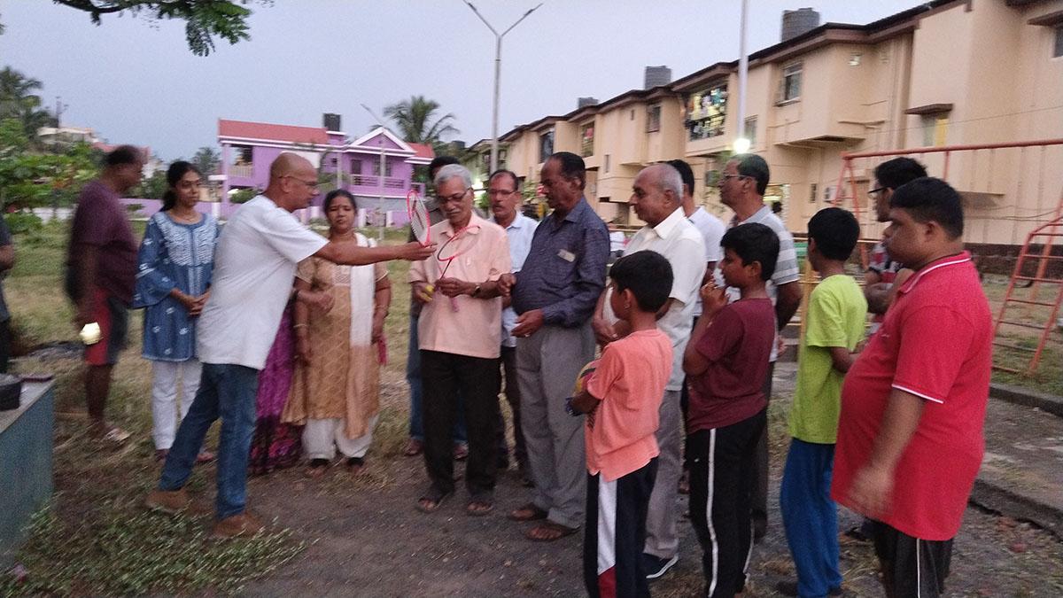 Badminton kits being distributed.