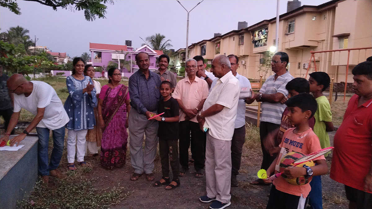 Badminton kits being distributed to children of Bharatnagar.